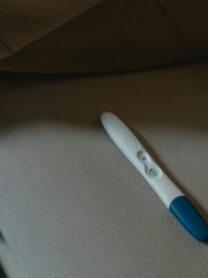 A close-up image of a pregnancy test resting on a soft fabric surface, symbolizing anticipation and new beginnings.